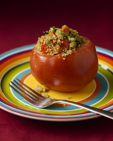 Quinoa-stuffed tomato on a plate