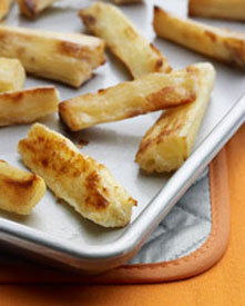 Oven-fried yuca on a baking sheet