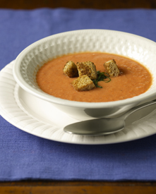 Zesty tomato soup topped with croutons in a bowl